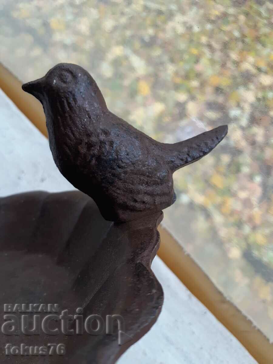 Delivery of Old small cast iron candle holder with a chick Delivery of Old small cast iron candle holder with a chick