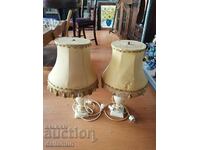 a pair of lamps with marble bases