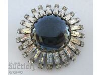 A beautiful old lady's round brooch with stones