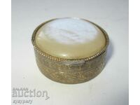 Old small round box with ornaments and mother of pearl