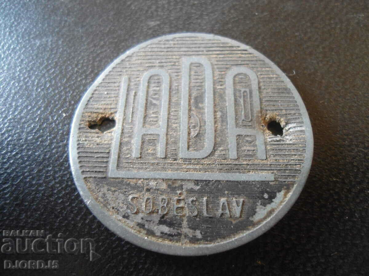 Old emblem from sewing machine "LADA"