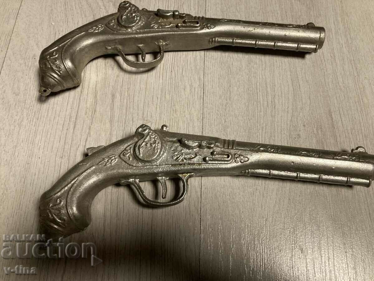 Flint capsule gun pair