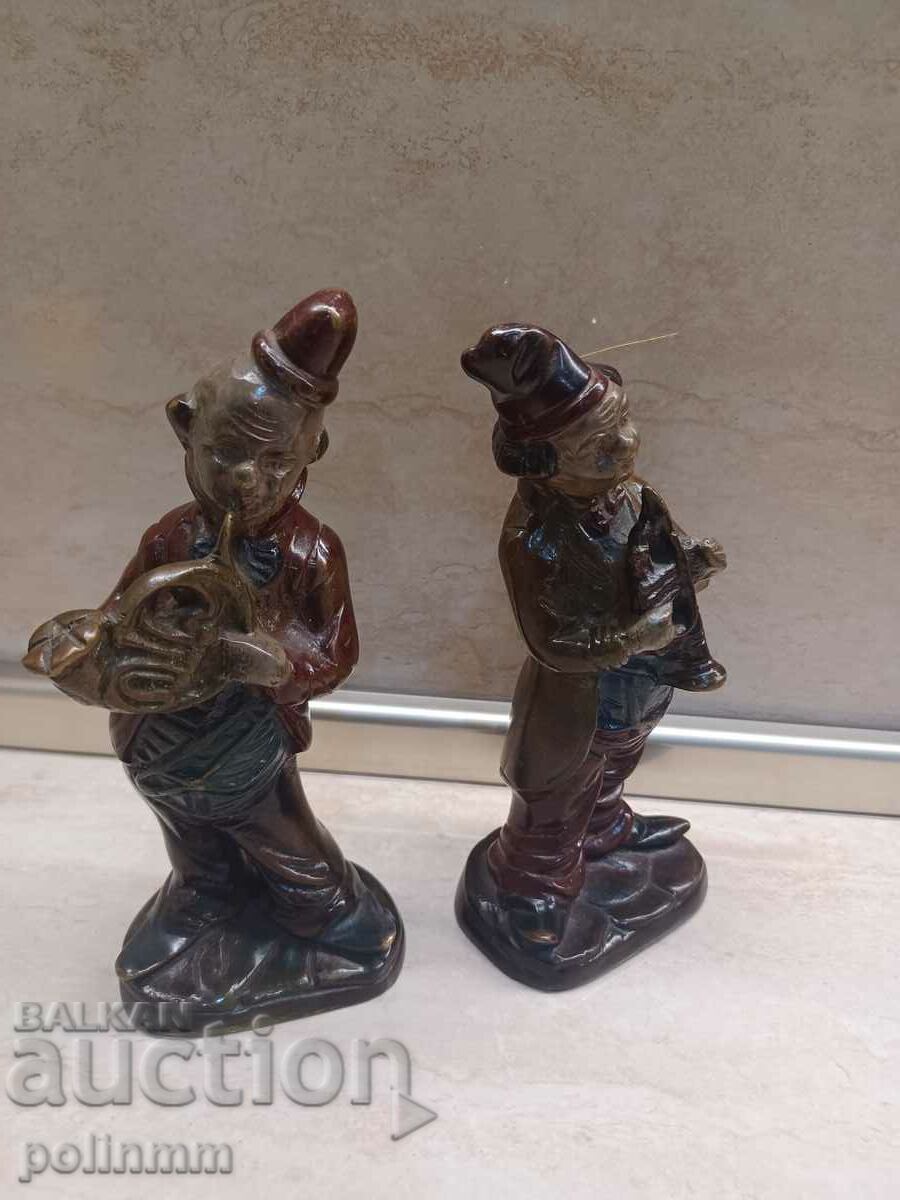 A pair of antique bronze statuettes