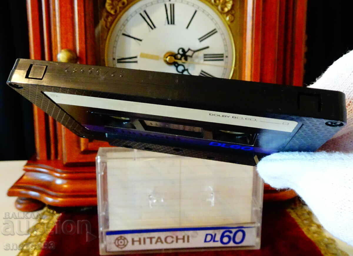 Delivery of Hitachi DL60 audio cassette with guitar. Delivery of Hitachi DL60 audio cassette with guitar.