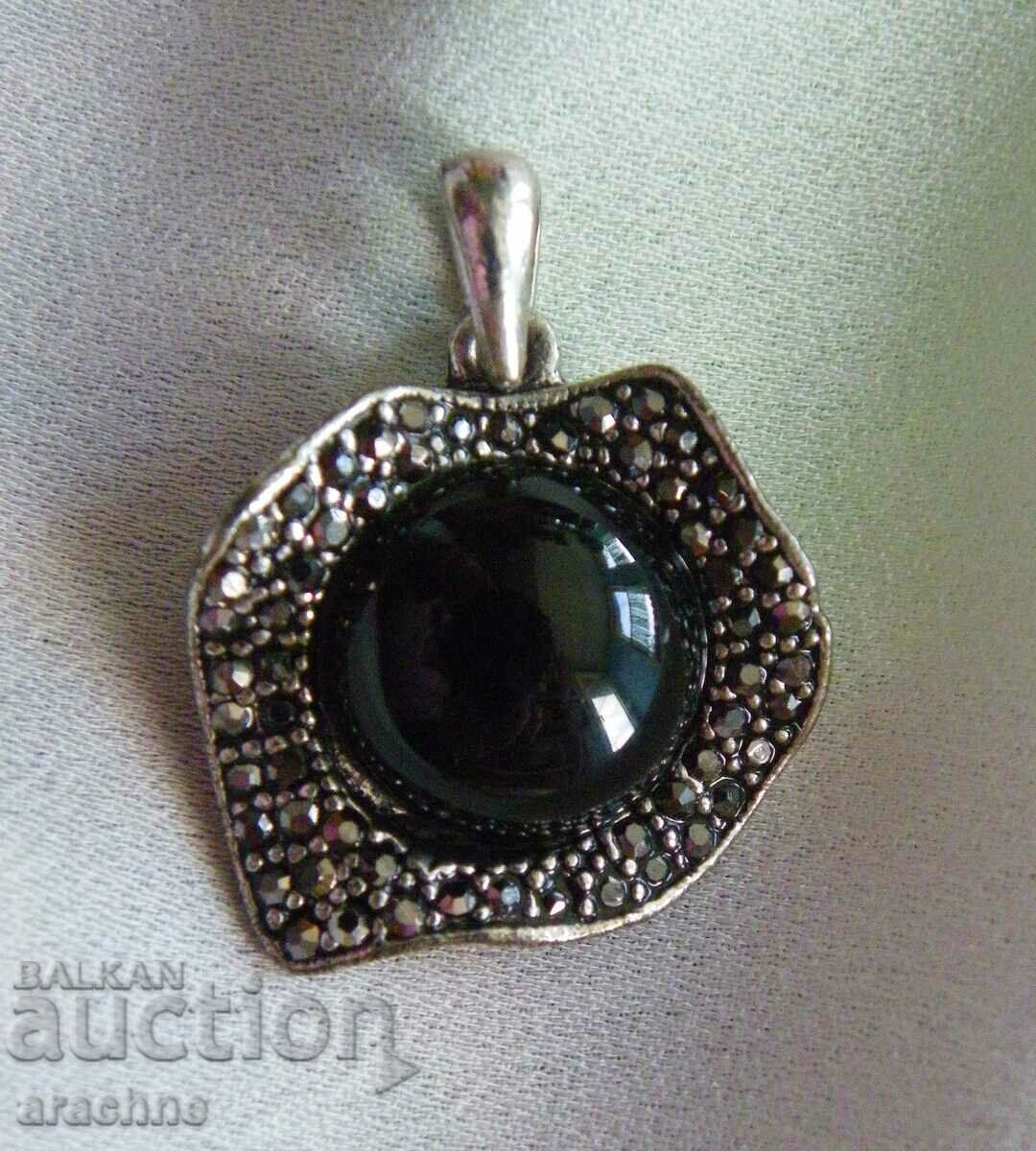 Silver locket with black tourmalines