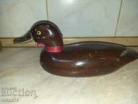 A great old wooden duck with a bronze beak