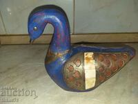 A great blue wood duck with brass and bone