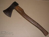 Old, branded hatchet, axe.