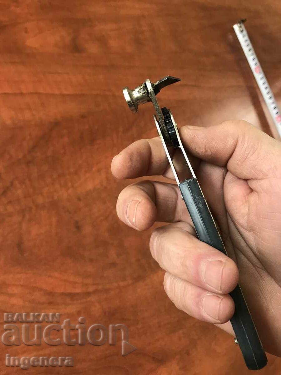 Auction  OPENER FROM THE OLD MATERIAL MARKED