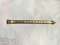 Gold plated vintage bracelet. It is marked MTI.