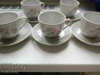 A collectible porcelain set of 5 coffee cups and saucers