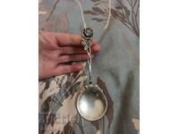 AN OLD SILVER SPOON WITH A BEAUTIFUL LARGE ROSE