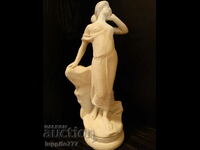 Sculpture statuette stylized female figure