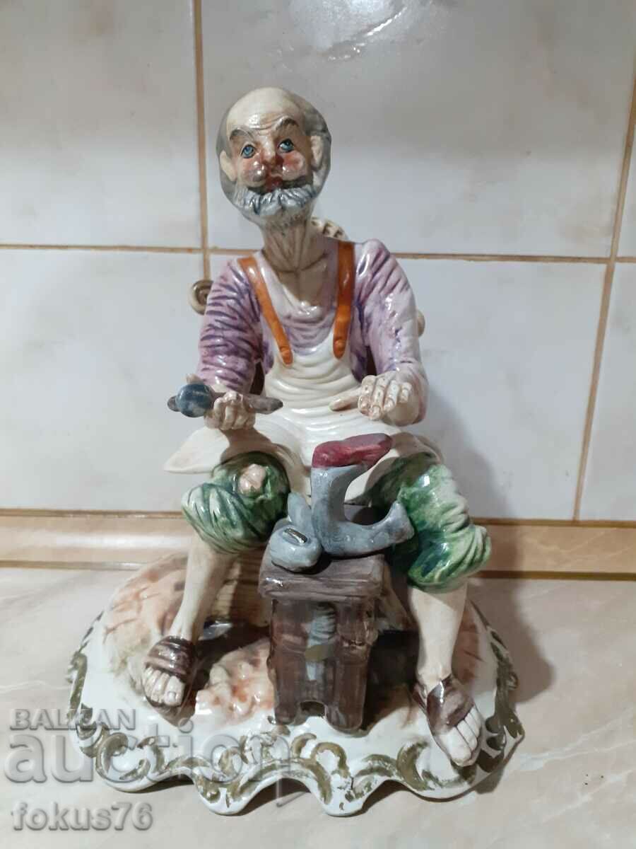 A great beautiful cobbler statuette with markings