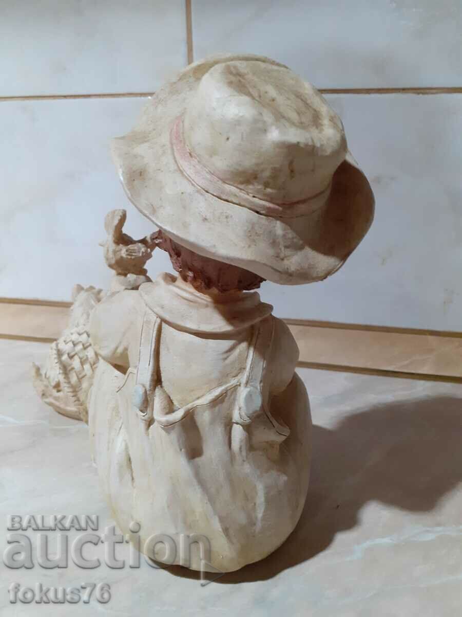 Delivery of A great beautiful figurine of a boy with puppies and a dove Delivery of A great beautiful figurine of a boy with puppies and a dove