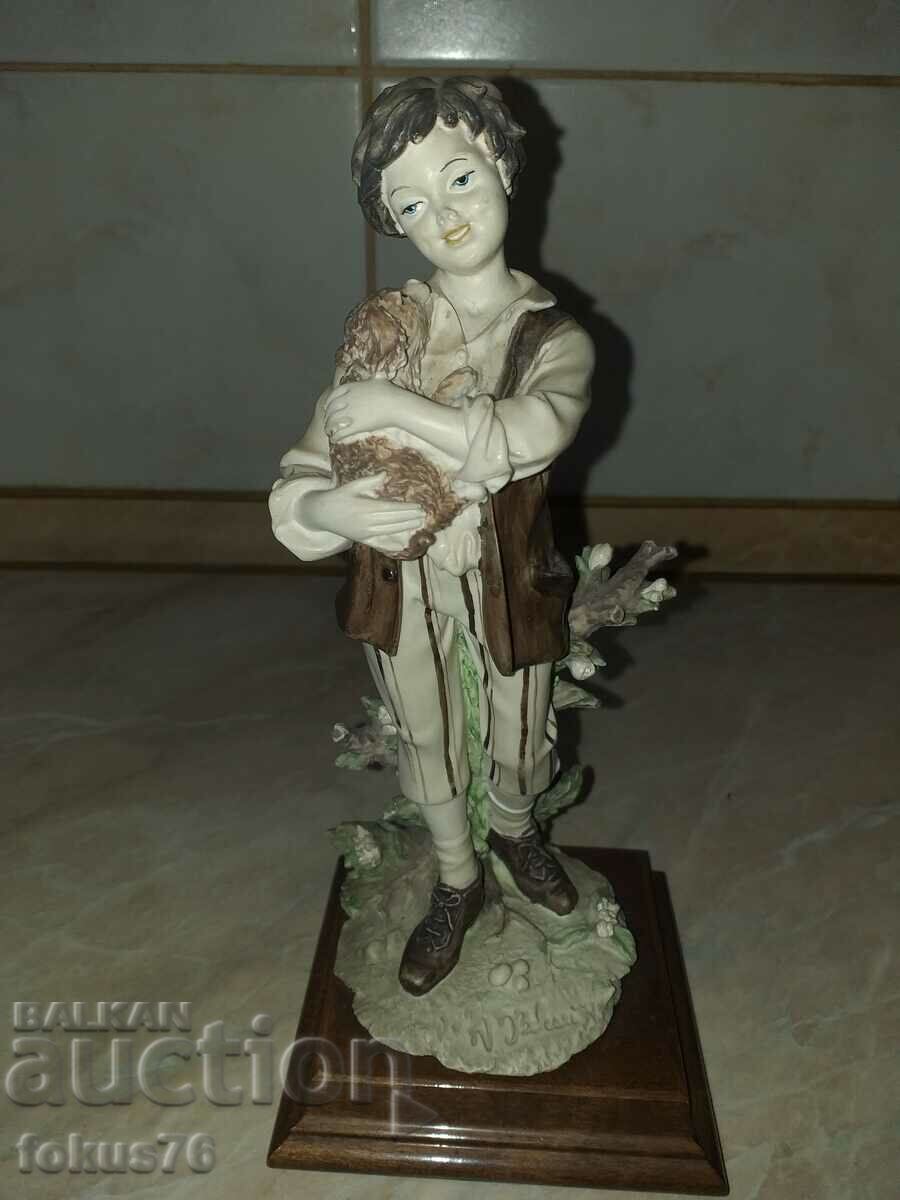 Auction A great beautiful figurine of a boy with a dog signed Auction A great beautiful figurine of a boy with a dog signed