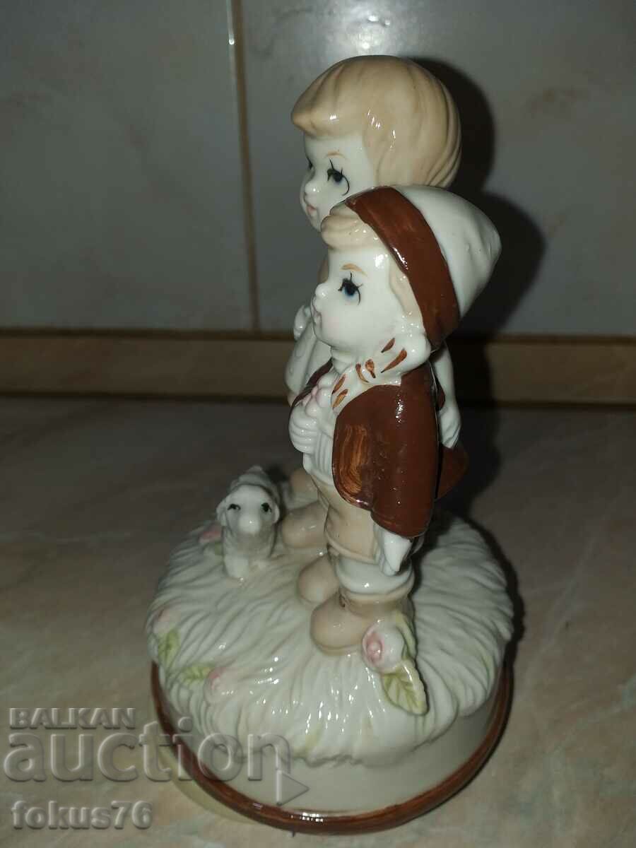 Delivery of Great beautiful figurine boy and girl - playing