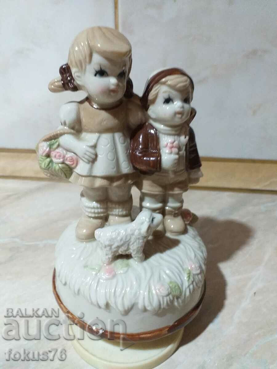 Great beautiful figurine boy and girl - playing