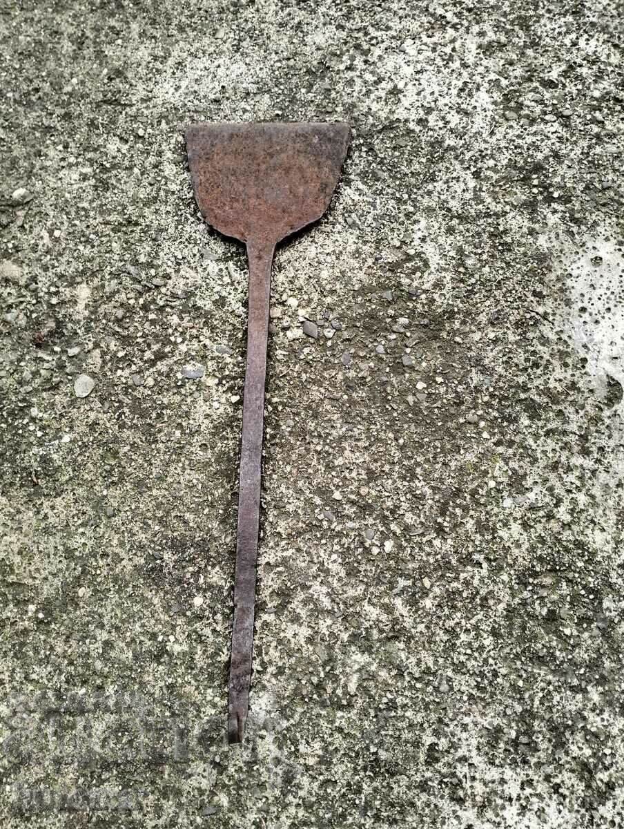 Old wrought iron scraper