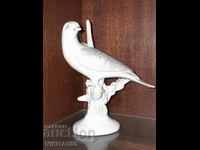 Old beautiful porcelain bird figure from Romania