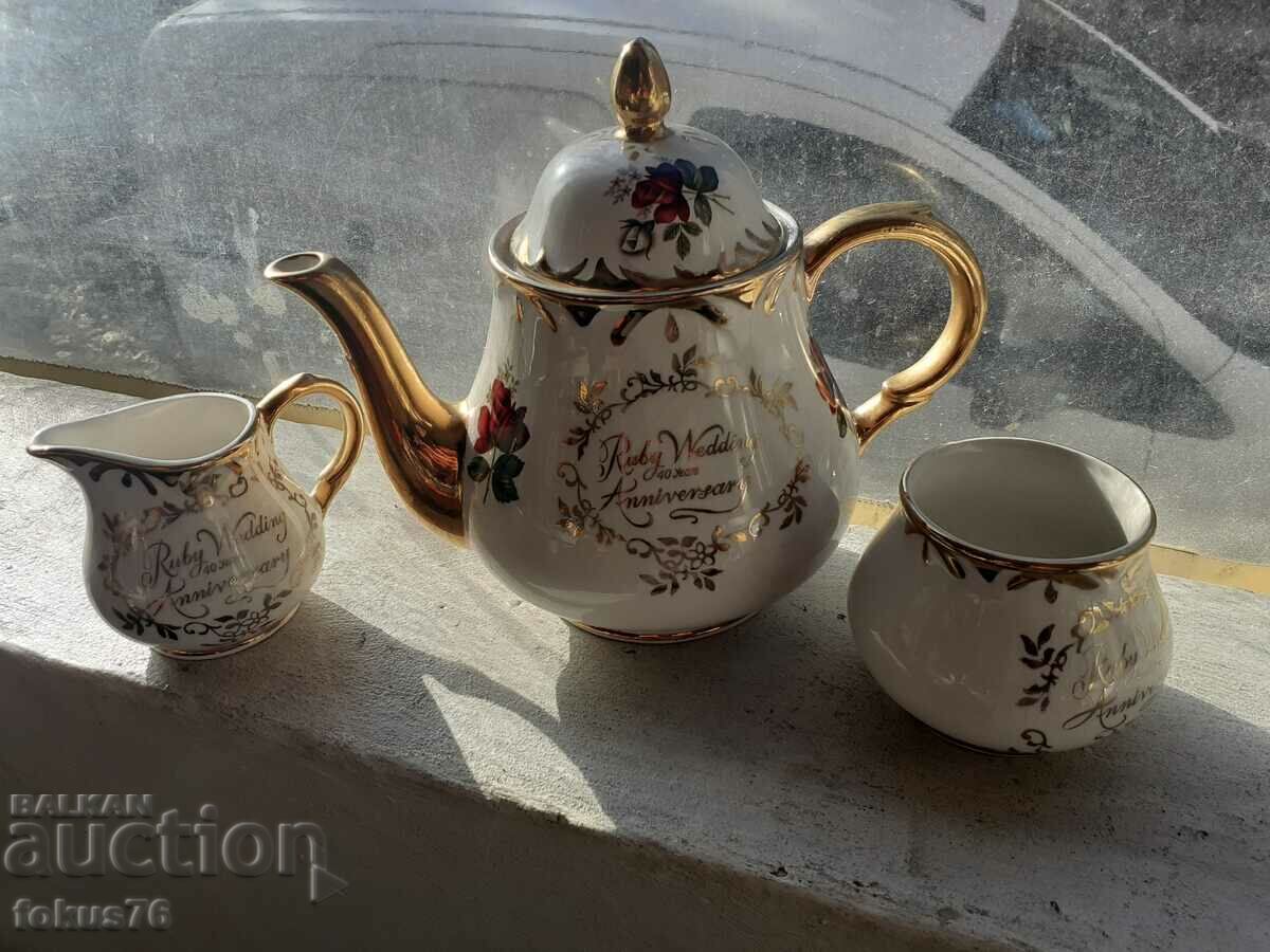 Auction  English porcelain tea set with thick gilt