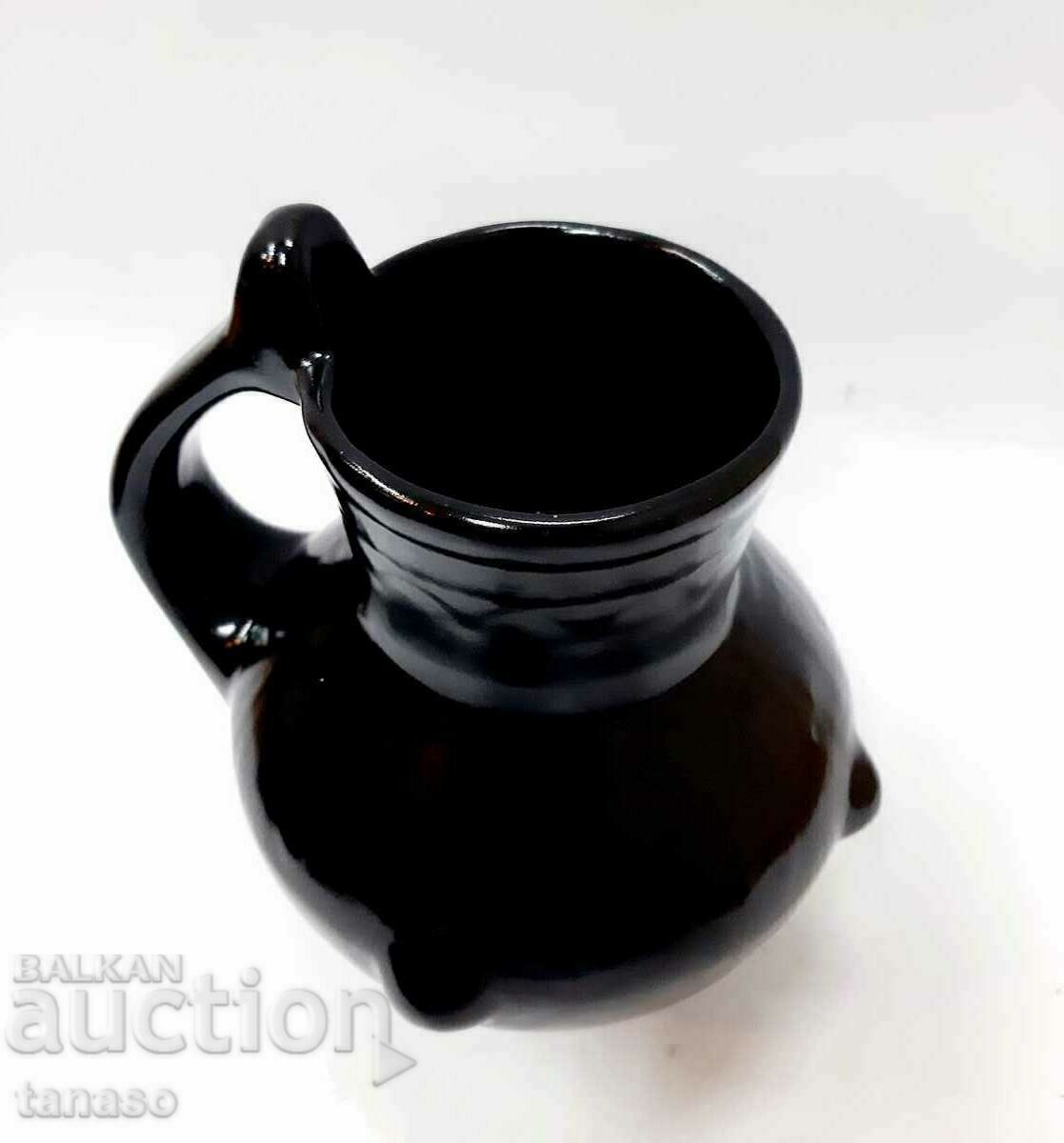 Delivery of Old black ceramic jug (6.2)