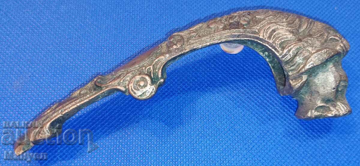 Old bronze part of a sword "Lion's head".