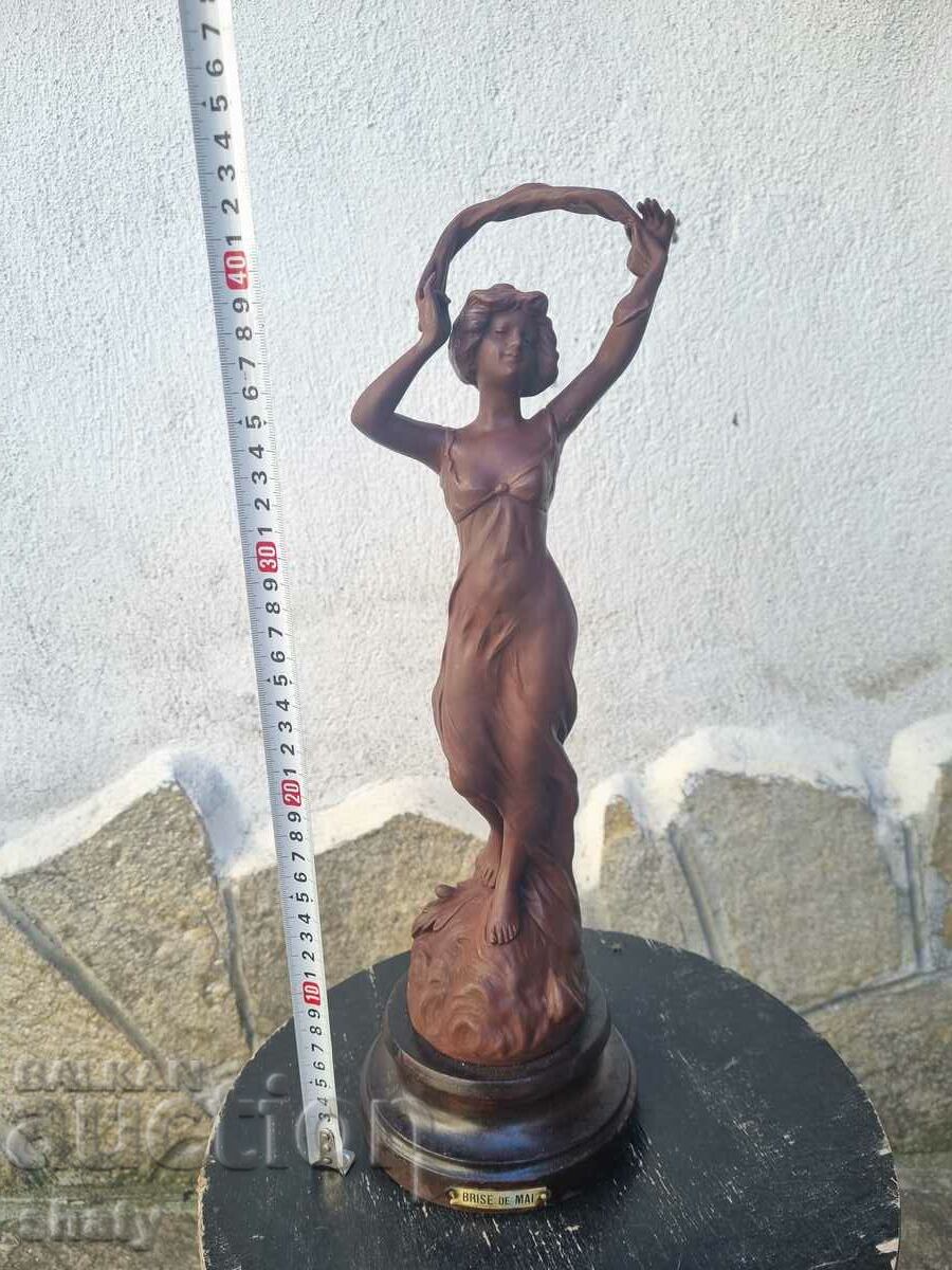 Old metal sculpture. Figure