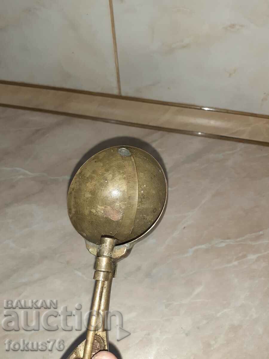 Delivery of Old bronze ice cream scoop Delivery of Old bronze ice cream scoop