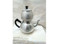 Russian ornamented metal teapot for infusion