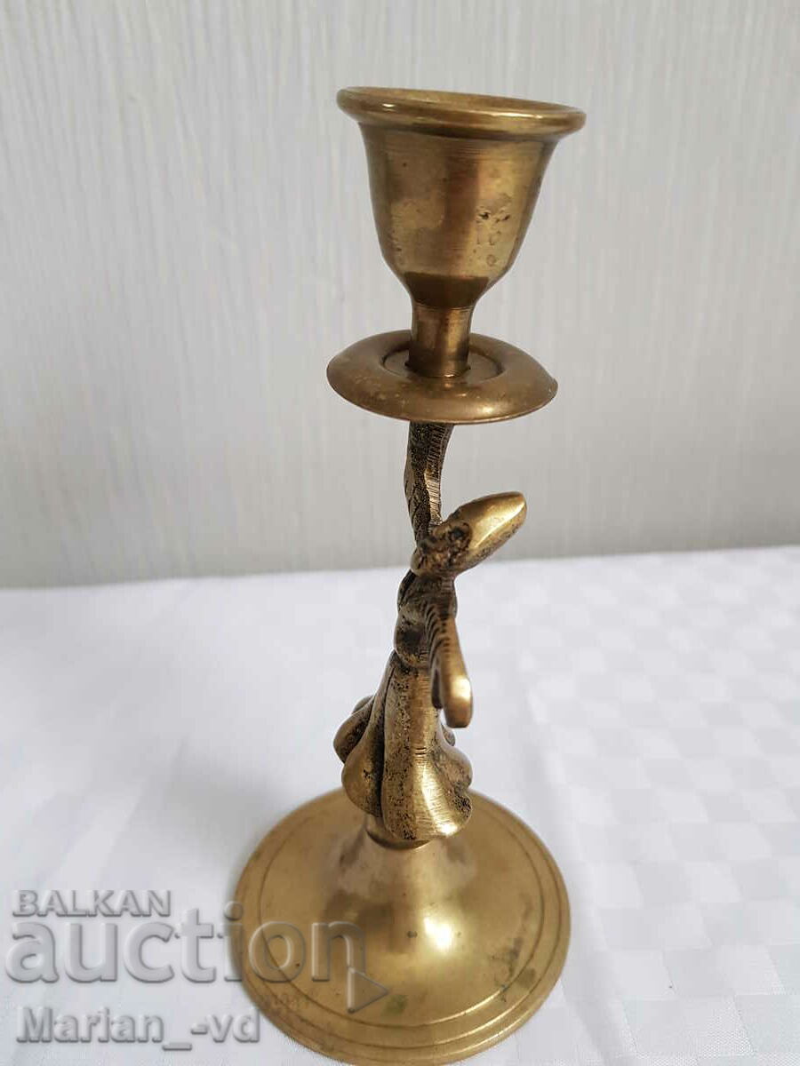 Auction Bronze candlestick with dervish Auction Bronze candlestick with dervish