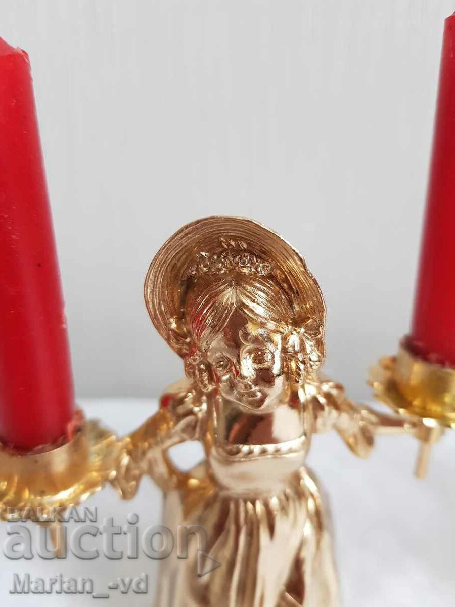 Delivery of Two new Italian metal candlesticks with a girl Delivery of Two new Italian metal candlesticks with a girl