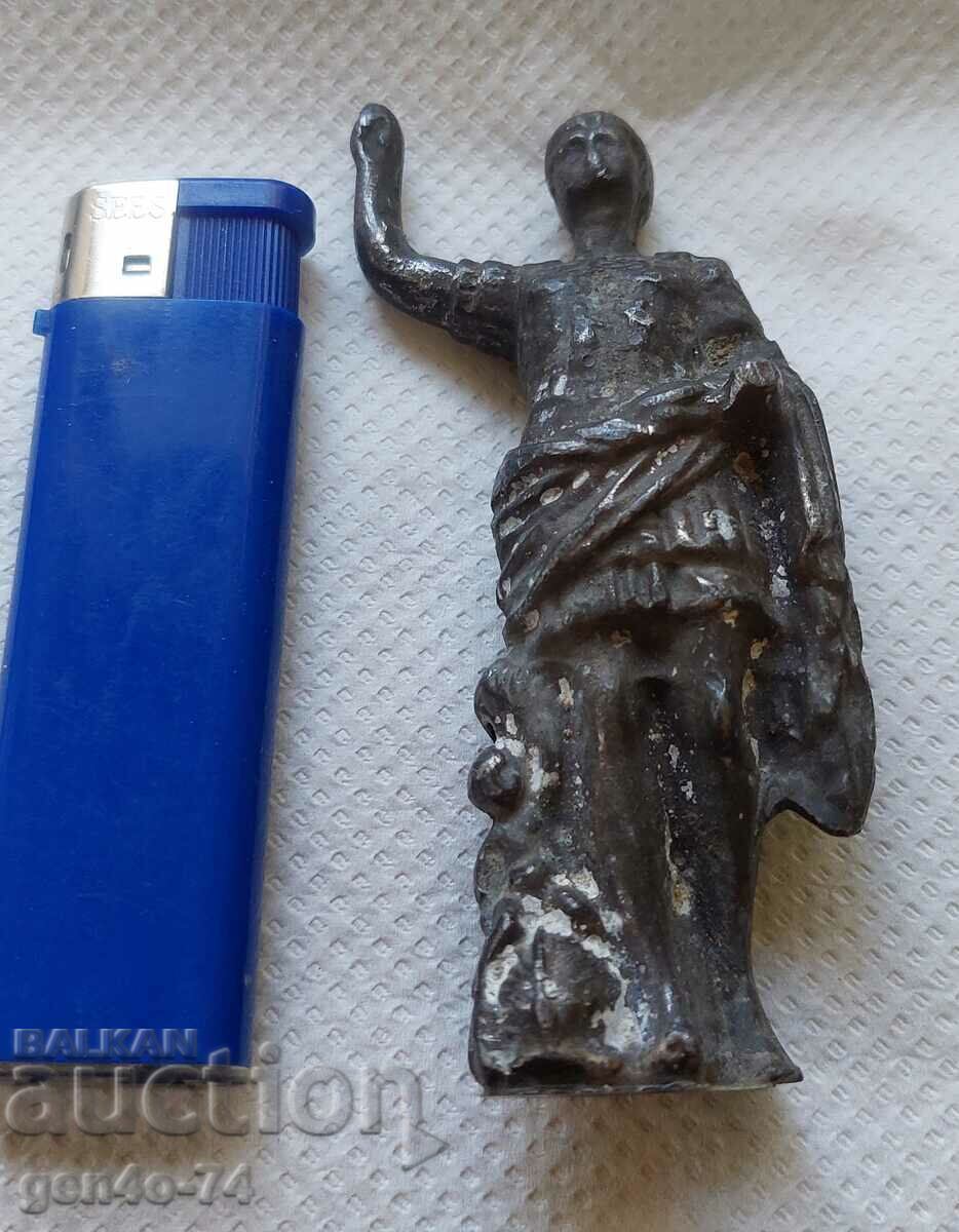 A metal figure of Caesar
