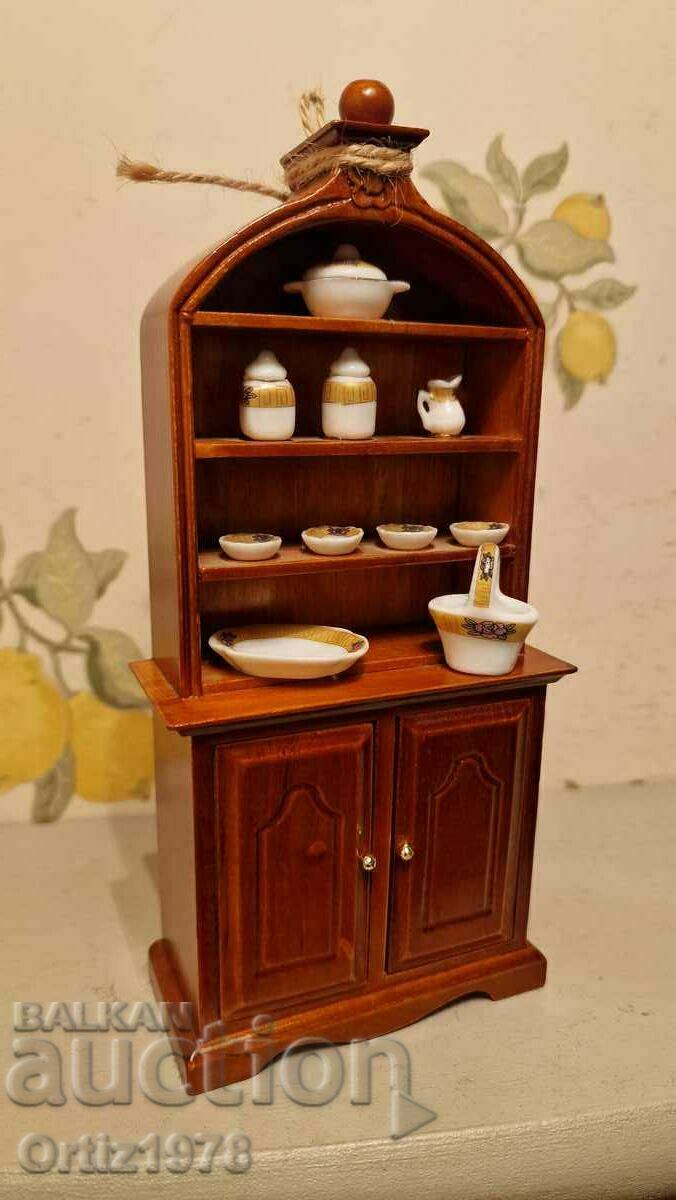 Old wooden cabinet with service – Toy.