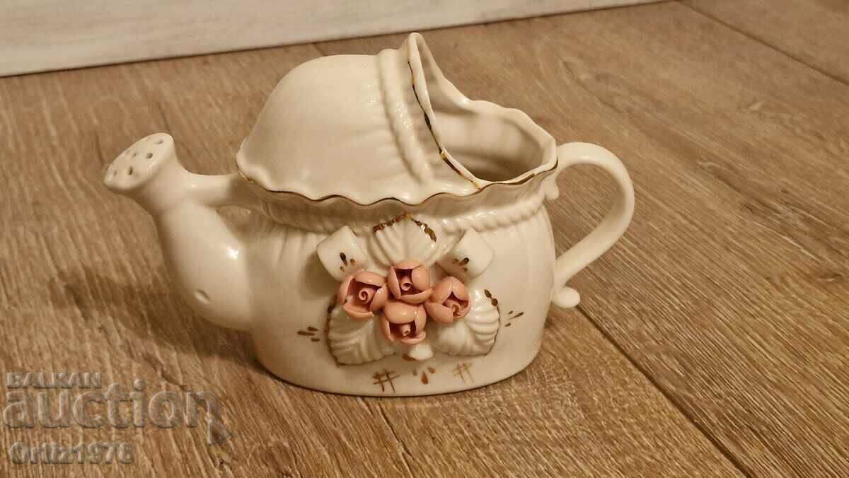 Old porcelain watering can, jug.