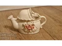 Old porcelain watering can, jug.