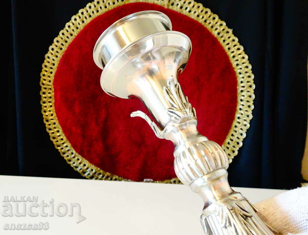 Auction Silver-plated candlestick, baroque. Auction Silver-plated candlestick, baroque.
