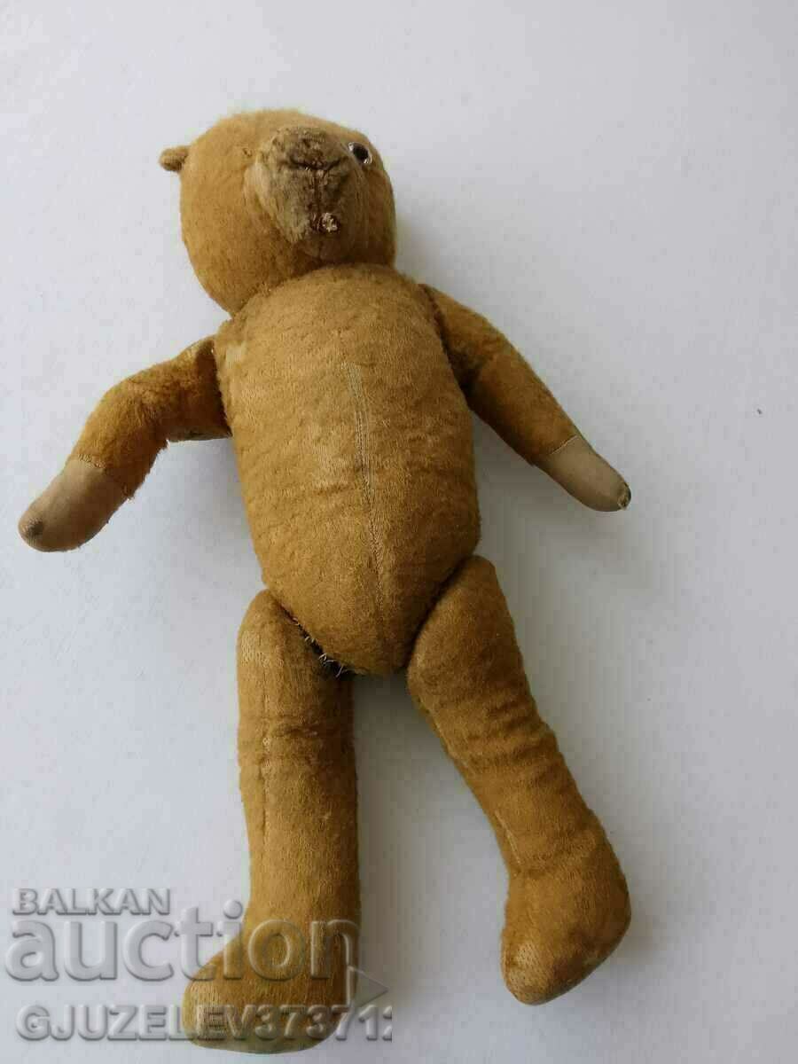 Old toy bear full of straw
