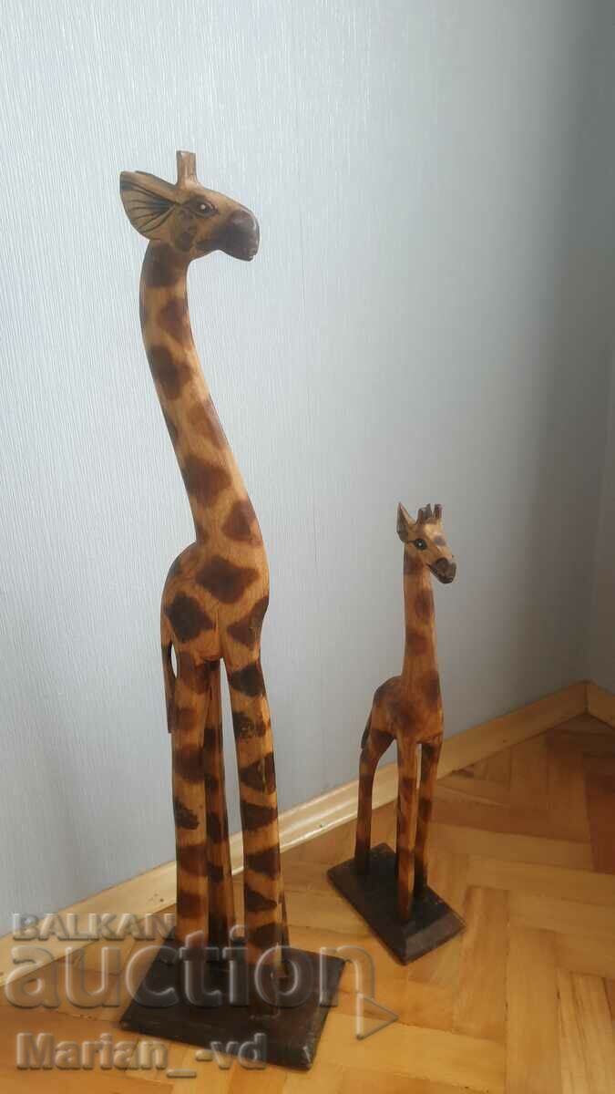 Auction Wooden African figures of giraffes Auction Wooden African figures of giraffes