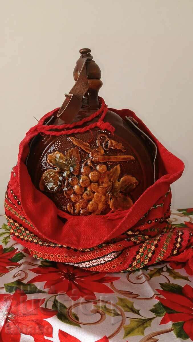 Large ceramic bowl with embroidered ethnic bag(s)