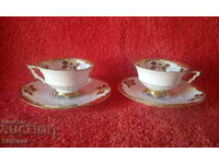 Two old double sets of Silesia gilt porcelain cups and saucers
