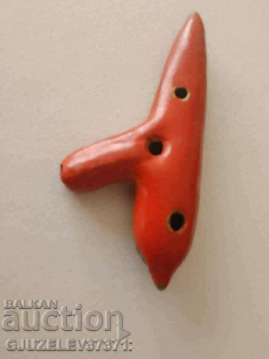 Delivery of An old lucarina ceramic whistle is slightly cracked but still plays