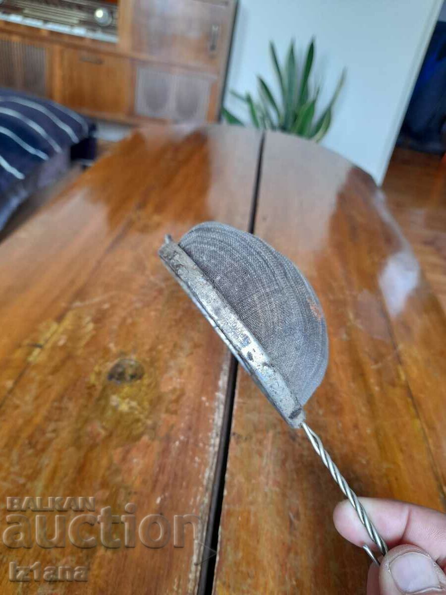 Auction An old kitchen strainer Auction An old kitchen strainer