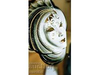 Ceramic mask with gold ornaments