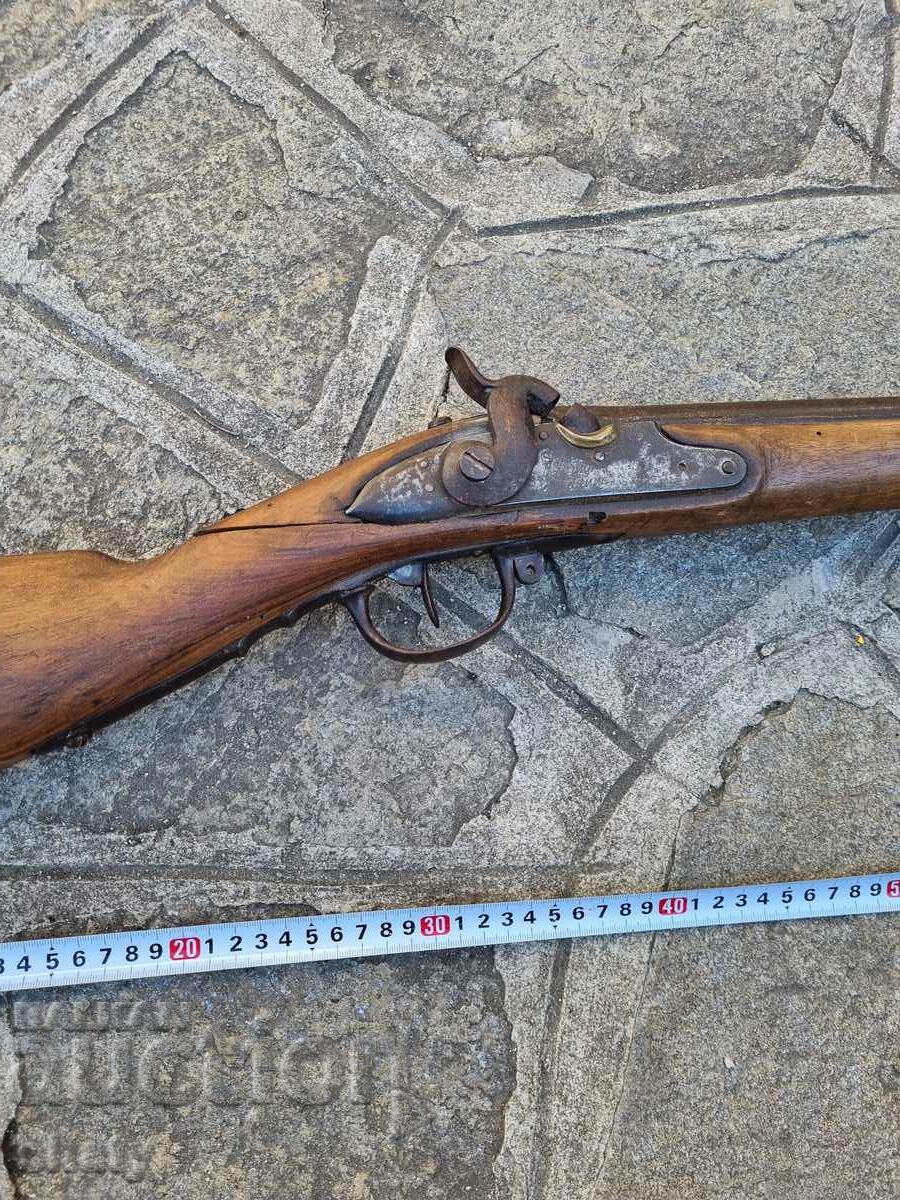 Auction  An old rifle. A musket