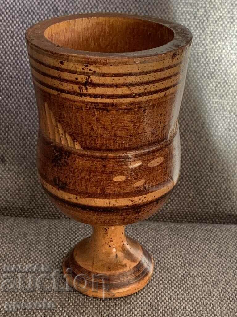 Old wooden goblet, glass