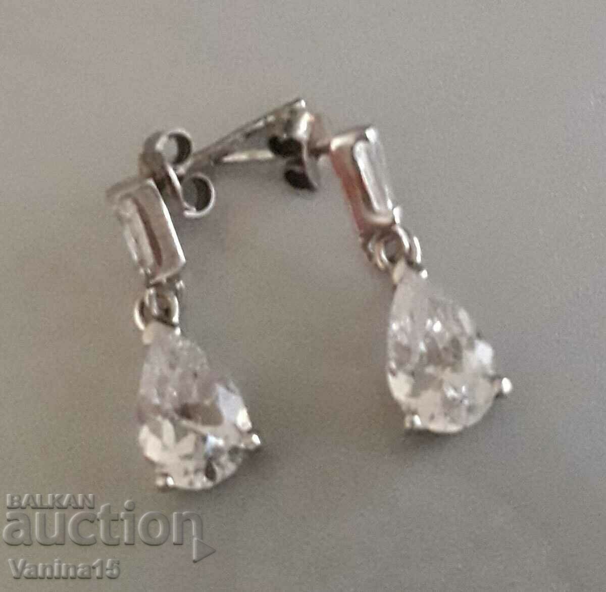 Delivery of Imported silver earrings with crystal