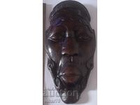 Old wooden wall mask