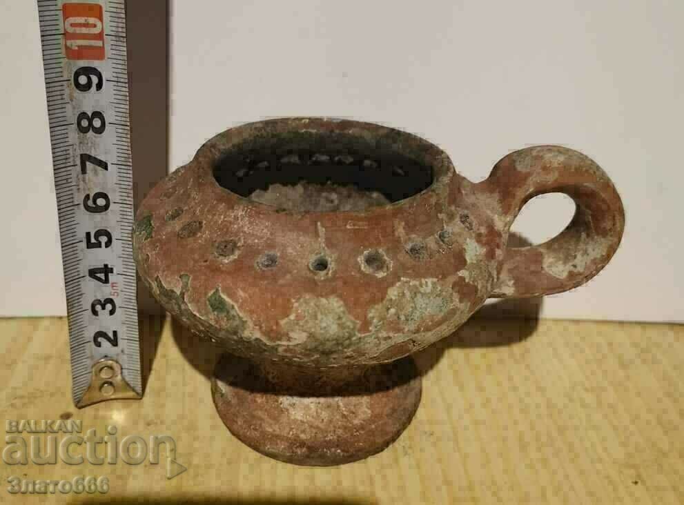 A very old clay lamp