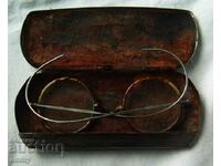 Old, vintage glasses, in a metal box